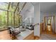 Light-filled living room with cathedral ceilings, a wall of windows, and modern decor at 106 Mill Rock Ct, Carrboro, NC 27510