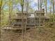The rear exterior shows multiple decks, large windows, and wooded backyard at 106 Mill Rock Ct, Carrboro, NC 27510