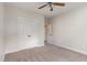 Bedroom with ceiling fan, carpet, and double door closet providing lots of space at 10744 Cokesbury Ln, Raleigh, NC 27614