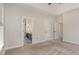 View of main bedroom featuring doorway into bathroom with black vanity and patterned floor at 10744 Cokesbury Ln, Raleigh, NC 27614