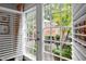 View of a manicured backyard through the french doors at 1112 Blenheim Dr, Raleigh, NC 27612