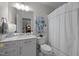 Bathroom with marble countertops, modern fixtures, and neutral decor at 1112 Blenheim Dr, Raleigh, NC 27612