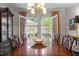 Dining area with french doors leading to the outdoor living area at 1112 Blenheim Dr, Raleigh, NC 27612