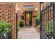 Charming brick entryway features a black iron gate and decorative brickwork at 1112 Blenheim Dr, Raleigh, NC 27612