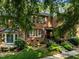 Lovely two-story brick home featuring lush landscaping and inviting curb appeal at 1112 Blenheim Dr, Raleigh, NC 27612