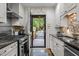 Well-lit kitchen with direct access to the outdoor living area at 1112 Blenheim Dr, Raleigh, NC 27612