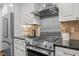 Updated kitchen with stainless steel range and stainless steel hood at 1112 Blenheim Dr, Raleigh, NC 27612