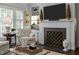 Cozy living room with built-in shelving, a fireplace, and plush seating at 1112 Blenheim Dr, Raleigh, NC 27612