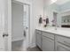 Bathroom featuring gray vanity with a sink and gray tile floors at 1148 Tringham Ct, Apex, NC 27502