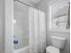 Bathroom featuring a shower with white tile, and a toilet at 1148 Tringham Ct, Apex, NC 27502