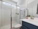 Beautiful bathroom featuring a shower with glass doors and white vanity at 1148 Tringham Ct, Apex, NC 27502