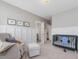 This Bedroom contains a crib, rocking chair with ottoman, and board and batten feature walls at 1148 Tringham Ct, Apex, NC 27502