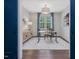 Bright office space with a modern desk, a stylish cabinet, and blue curtains at 1148 Tringham Ct, Apex, NC 27502