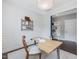 Bright office with a modern desk, stylish shelving, and a view to the mudroom at 1148 Tringham Ct, Apex, NC 27502