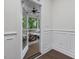 View of outdoor porch featuring ceiling fan, wood flooring, and comfortable furniture at 1148 Tringham Ct, Apex, NC 27502