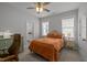 Cozy bedroom with a view to the en-suite bathroom and a chest of drawers at 117 Banning Dr, Pittsboro, NC 27312