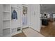 Inviting entryway with a mudroom, storage hooks and view of the kitchen and living space at 117 Banning Dr, Pittsboro, NC 27312