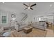 Spacious living room with hardwood floors, fireplace, and a view to the kitchen and staircase at 117 Banning Dr, Pittsboro, NC 27312