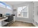 Bright office space with built-in shelves, a comfortable chair, and large window letting in natural light at 117 Banning Dr, Pittsboro, NC 27312