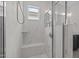 Elegant shower with a rainfall showerhead, bench, and built-in shelving at 117 Banning Dr, Pittsboro, NC 27312