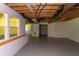 Unfinished basement with exposed ducts, concrete flooring, and natural light from a window at 117 Carolina Forest Rd, Chapel Hill, NC 27516