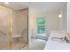 Bathroom featuring a glass-enclosed shower, vanity, and natural light at 117 Carolina Forest Rd, Chapel Hill, NC 27516