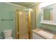 Bathroom featuring a shower with gold frame, a granite countertop sink and a toilet at 117 Carolina Forest Rd, Chapel Hill, NC 27516