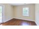 Bedroom with door to deck and hardwood flooring at 117 Carolina Forest Rd, Chapel Hill, NC 27516