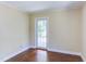 Bedroom with door to deck and hardwood flooring at 117 Carolina Forest Rd, Chapel Hill, NC 27516