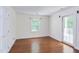 Bedroom features a window, closet and door to deck at 117 Carolina Forest Rd, Chapel Hill, NC 27516