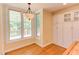 Cozy breakfast nook with built-in cabinets and lots of light from the windows at 117 Carolina Forest Rd, Chapel Hill, NC 27516
