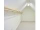 A spacious walk-in closet has wall to wall carpeting, clothes bars and built-in storage space at 117 Carolina Forest Rd, Chapel Hill, NC 27516