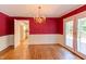 Elegant dining room with wainscoting, French doors, and chandelier at 117 Carolina Forest Rd, Chapel Hill, NC 27516