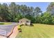 Charming home exterior with well-manicured landscaping, brick paver walkway, and long driveway at 117 Carolina Forest Rd, Chapel Hill, NC 27516