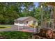 Detached two-car garage with a charming brick walkway and lush landscaping, adding to curb appeal at 117 Carolina Forest Rd, Chapel Hill, NC 27516