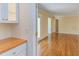 Bright hallway with hardwood floors leads to spacious living areas at 117 Carolina Forest Rd, Chapel Hill, NC 27516