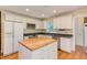 Updated kitchen features a central island, stainless appliances and granite countertops at 117 Carolina Forest Rd, Chapel Hill, NC 27516
