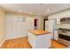 Well-appointed kitchen featuring stainless steel appliances, island, and ample storage at 117 Carolina Forest Rd, Chapel Hill, NC 27516