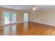 Open-concept living area with hardwood floors and access to the outdoor deck at 117 Carolina Forest Rd, Chapel Hill, NC 27516