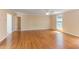 Spacious living room with hardwood floors, ceiling fan and ample natural light at 117 Carolina Forest Rd, Chapel Hill, NC 27516