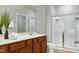 Bright bathroom featuring a glass enclosed shower and vanity with storage at 118 Rosedale Creek Dr, Durham, NC 27703