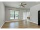 Bright bedroom space features wood floors and a large window for an abundance of natural light at 118 Rosedale Creek Dr, Durham, NC 27703