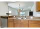 Spacious kitchen with stainless steel dishwasher and wooden cabinets, perfect for cooking and entertaining with ease at 118 Rosedale Creek Dr, Durham, NC 27703