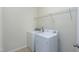 Functional laundry room with modern washer and dryer and shelving at 118 Rosedale Creek Dr, Durham, NC 27703