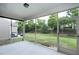 Inviting screened porch overlooking the backyard provides a comfortable outdoor relaxation space at 118 Rosedale Creek Dr, Durham, NC 27703