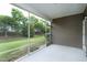 Screened porch offers outdoor living with views of the well-maintained backyard at 118 Rosedale Creek Dr, Durham, NC 27703