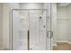 Clean shower features tiled walls, glass door and corner shelves at 118 Rosedale Creek Dr, Durham, NC 27703