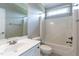 Bright bathroom features a shower and tub combination and a single sink vanity at 120 Gentle Rain Dr, Garner, NC 27529