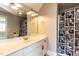 Bathroom includes a single sink vanity with matching mirror and shower with curtain at 120 Gentle Rain Dr, Garner, NC 27529