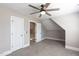 Bedroom shows vaulted ceilings, plush carpet, ceiling fan, and closet with doors at 120 Gentle Rain Dr, Garner, NC 27529